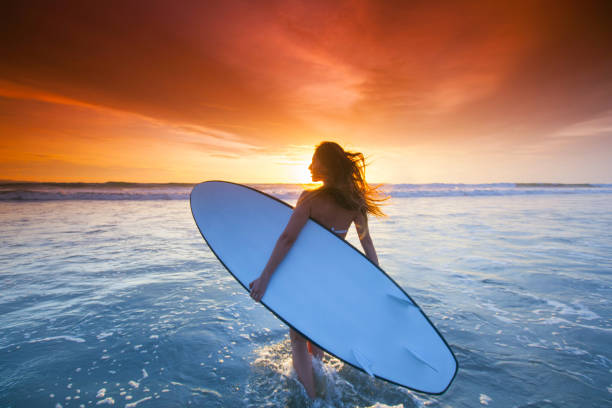 istock Woman with surfboard 1486777881