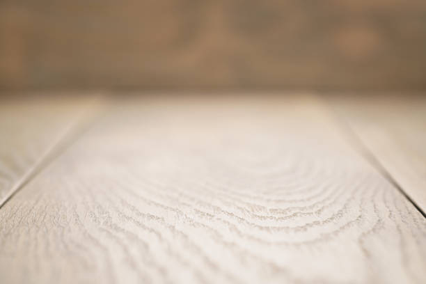 istock wooden tablce perspective background with shallow focus 1486778410