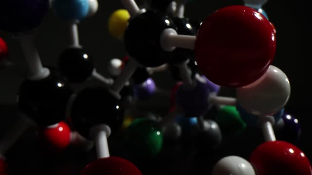 Plastic model of molecule and crystal lattice of atom