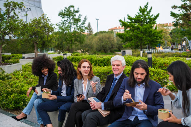 istock Group of coworkers taking a break in business district 1486780718