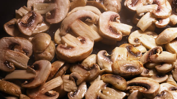 istock Champignons are cooked in a pan. Macro shoot. 1486781337