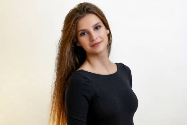 istock Happy attractive girl is posing on the light background. 1486781683