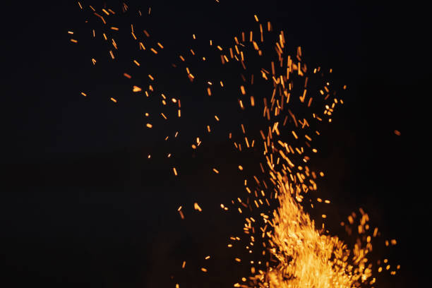 istock bonfire spark in the dark sky in night 1486782272