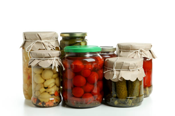 istock Jars of pickled vegetables isolated on white background 1486782527