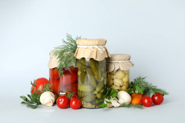 istock Jars of pickled vegetables on light gray background 1486782586