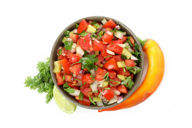 istock Bowl of Pico de Gallo isolated on white background 1486787210