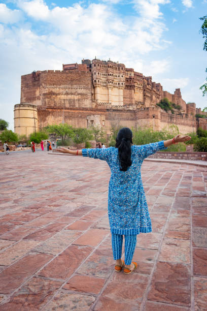 istock girl standing shot with ancient fort background at day from flat angle 1486788183