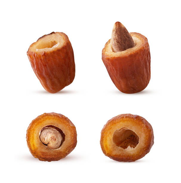 istock Set golden date fruit cut in half with bone 1486788855