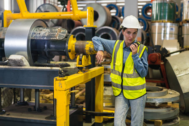 istock The project manager and engineers are inspecting workpieces and checking standards and safety for products and safety in the factory. Technician and Female Worker Talking on a Meeting in a Factory. 1486789145
