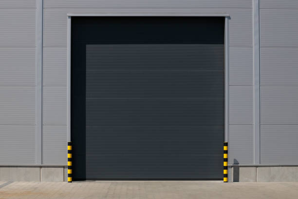 istock Industrial grey roller shutter door for loading dock in factory building. 1486789251