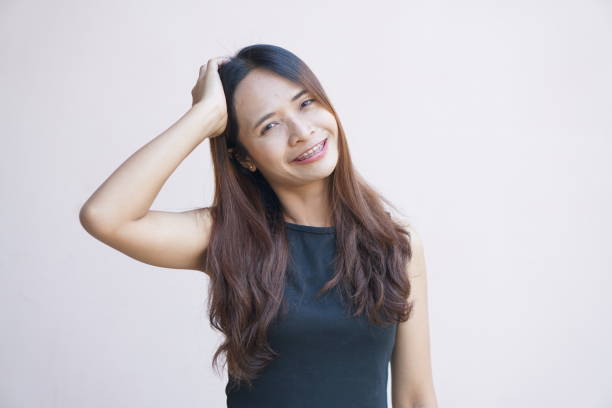 istock Asian woman smiling happily braces 1486790489