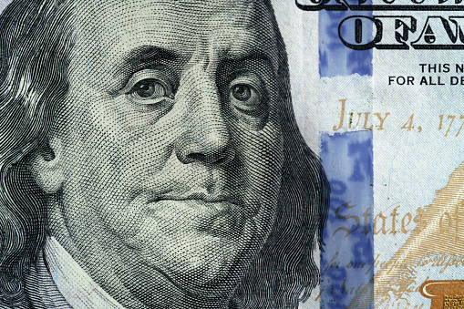 macro photo of hundred dollar bill, very shallow focus