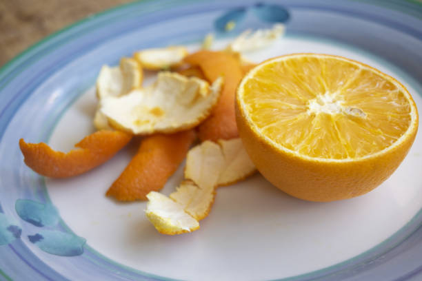 istock orange cut in half with peels beside 1486791287