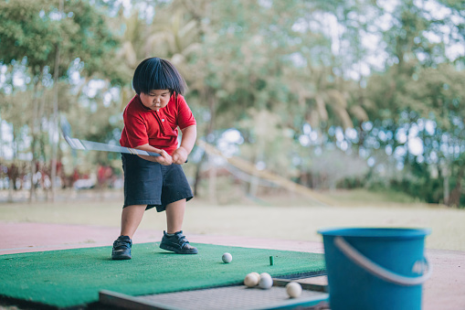 Boy Rang Asian Chinese Cute Boy Practicing Gold Swing In Driving Range During ...