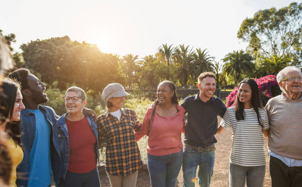 istock Group of multigenerational people hugging each others - Support, multiracial and diversity concept - Main focus on senior african woman face 1486791544
