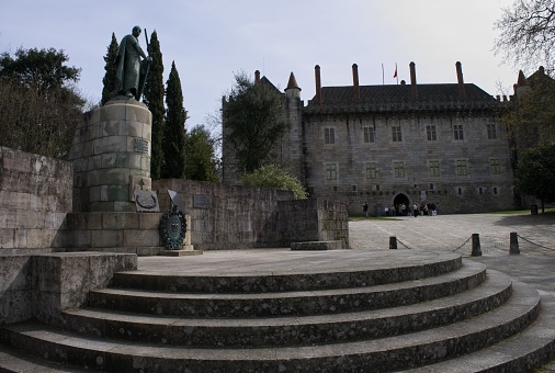 Guimaraes, Portugal - March 19, 2023: The Palace of the Dukes of Braganza is a medieval estate and former residence of the first Dukes of Braganza. Sunny spring day. Selective focus.