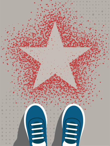 istock Feet in sneakers stand in front of the star sign 1486793277