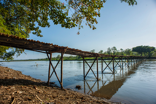a bamboo bridge that connects between villages