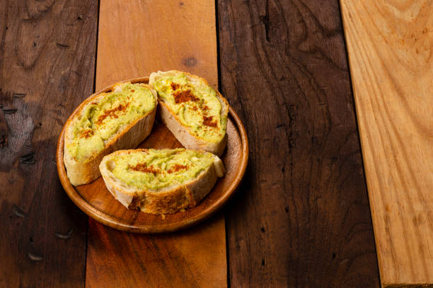 istock Toasted bread with hummus of chick pea  and a ovocado 1486800051
