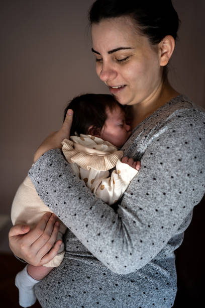 istock Few weeks old baby enjoy with her mother. 1486803044