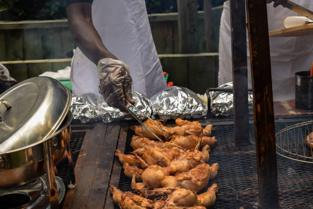 Outdoor Barbecuing Man barbecuing chicken kenyan man stock pictures, royalty-free photos & images