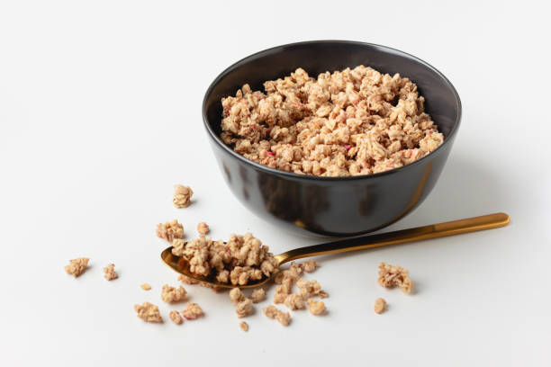 istock Granola in bowl on light background. 1486803391