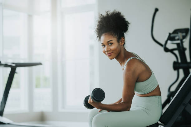 istock woman workout with dumbbells 1486803668