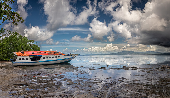 A public boat when tide is low on Bunaken Island in North Sulawesi.