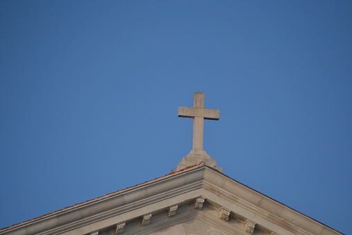 the christian cross on a building in venice italy