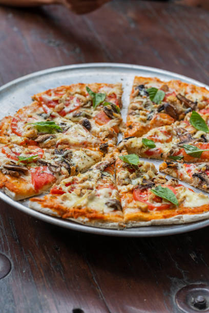 istock Delicious vegan Pizza on the table 1486812138