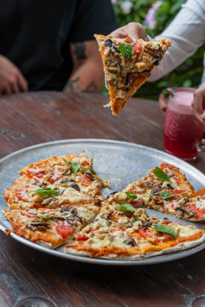 istock Delicious vegan Pizza on the table 1486812228