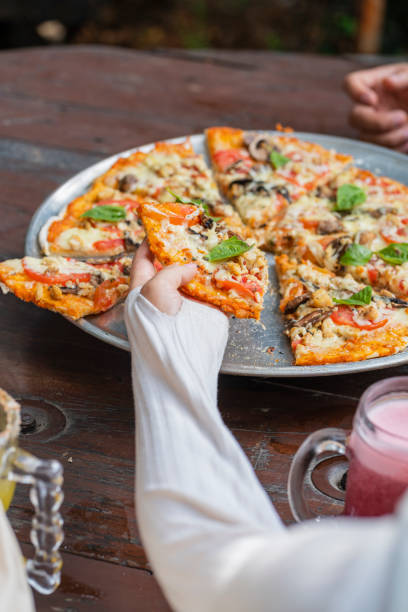 istock Delicious vegan Pizza on the table 1486812313