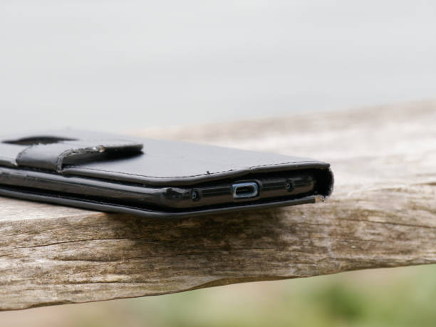 istock black smartphone on a wood bench in the park 1486813383