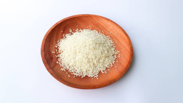 istock White rice on wooden plates 1486817693