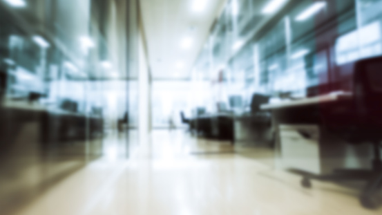 Abstract blurred motion office background, blurry working space with defocused effect, business concept.