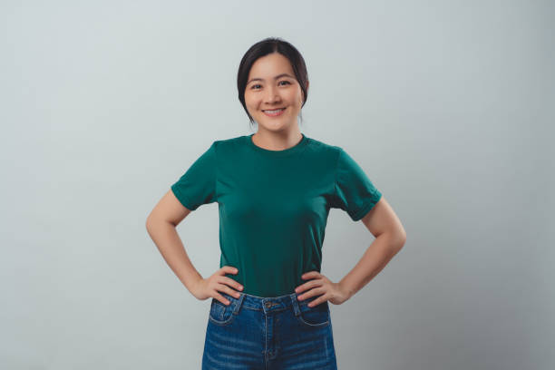 istock Asian woman happy smiling standing isolated on background. 1486818436