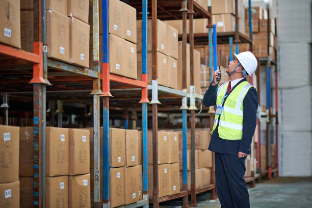 istock One Asian Man Look up and Examining Shelf 1486819077