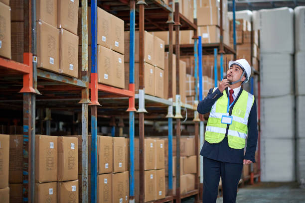 istock One Asian Man Look up and Examining Shelf 1486819119