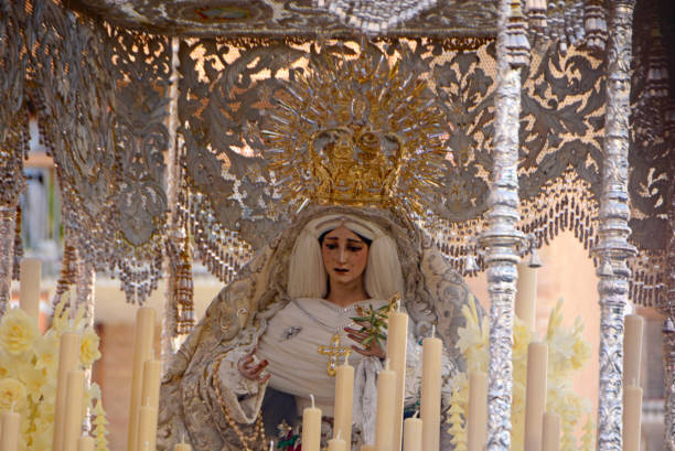 Virgin mary. Cordoba: Leaving Virgin Mary with royal cape   embroidered with gold thread. Virgin Mary is crying.The procession of Jesus. the passion of jesus stock pictures, royalty-free photos & images