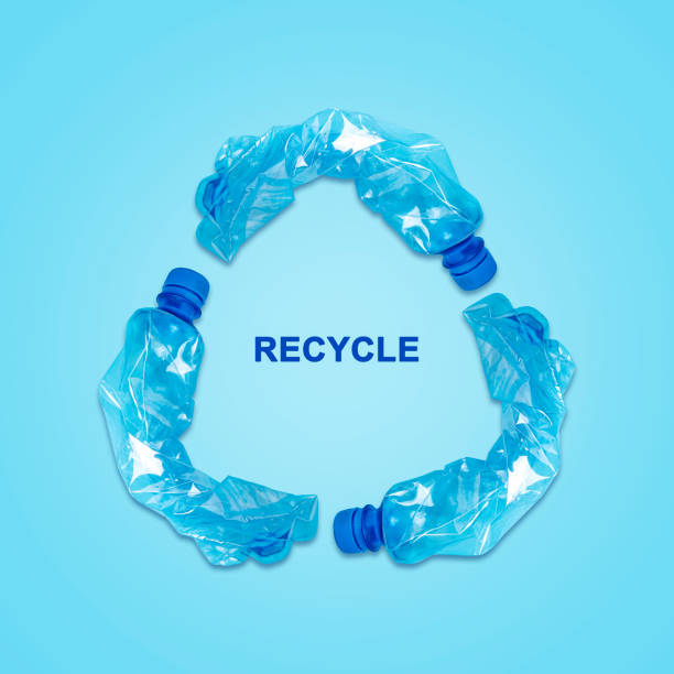 istock Recycle sign, from Crumpled Plastic bottles. On blue background. Recycling collection. Ecology. 1486827723