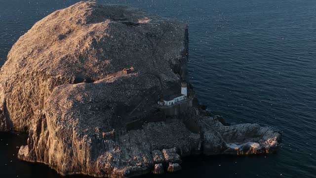 Drone video showing Bass Rock on a summers day, Scotland, United Kingdom