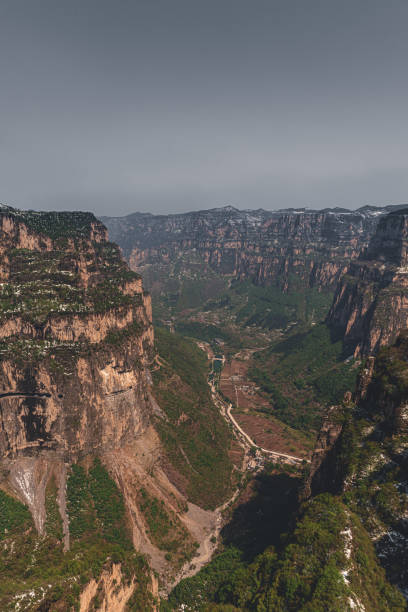 istock The village and road in the valley 1486830120