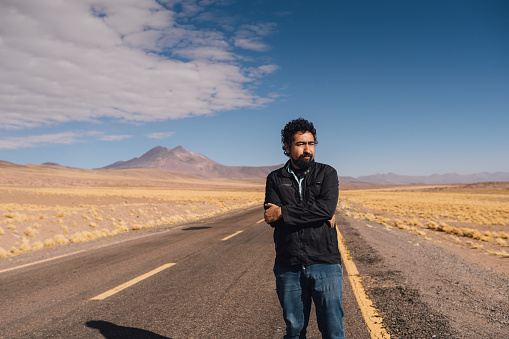 Man on a desert road in Atacama