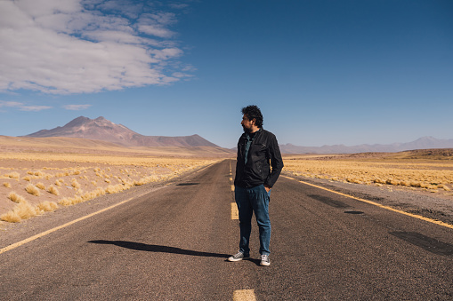 Man on a desert road in Atacama