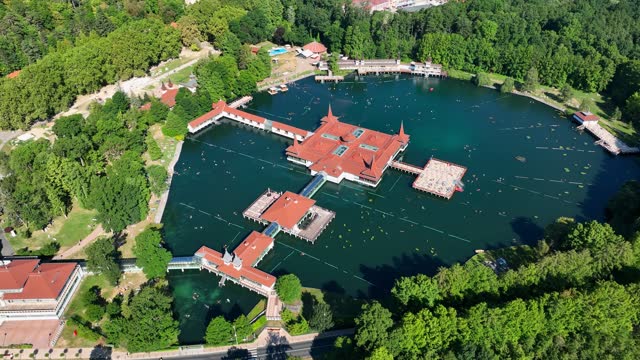 Aerial view of Heviz Lake in Hungary. Flying over Heviz lake spa - unique natural thermal water lake