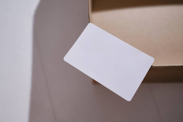 istock Blank business card, postcard on a colored background. Place for text and information. Mockup 1486833605