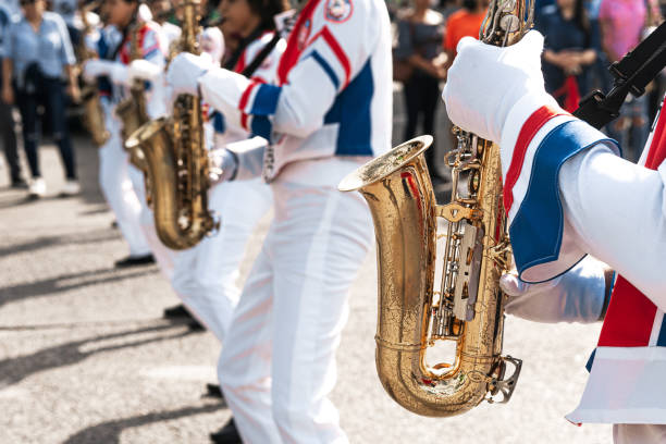 istock Group of saxophonists playing a saxophone in a patriotic march 1486834051