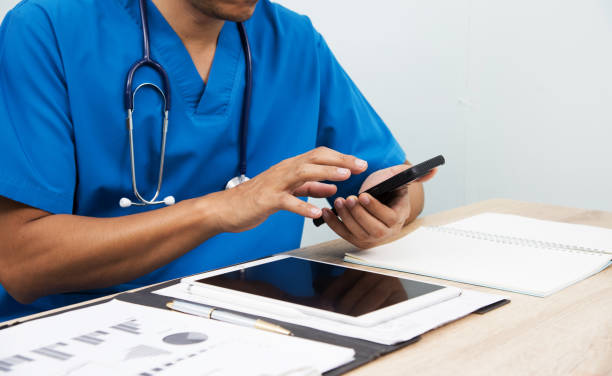 istock Smart medicine doctor working with computer notebook and digital tablet at desk in the hospital. Medical concept 1486834468