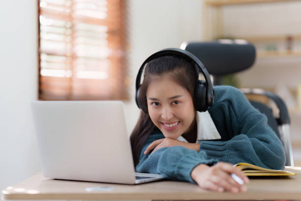 istock E-learning ,online ,education and internet social distancing. Asian woman student video conference e-learning with teacher on laptop computer at home. 1486836083