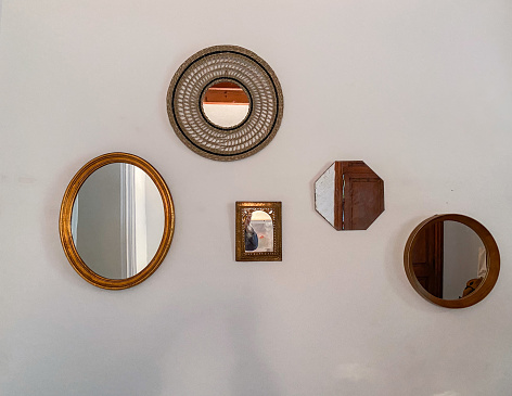 Mirrors placed randomly on the wall of the house